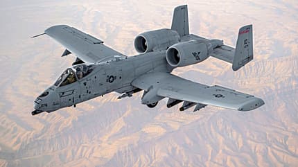 A U.S. Air Force KC-135 Stratotanker refuels A-10 Thunderbolts