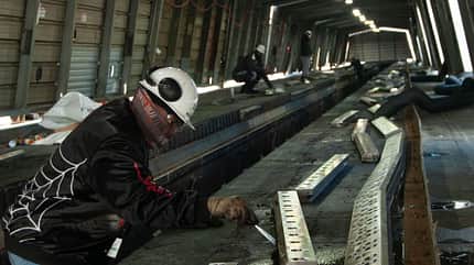 USS John C. Stennis,CVN 74,Norfolk,Navy Contractor Cleans Catapult Gears