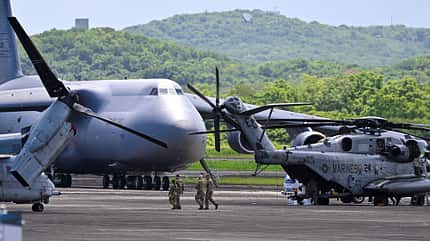 F-35, Puerto Rico, C-5 C-5M Galaxy und MH-53 auf Vorfeld vor Dschungel
