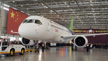 People Celebrate The Rolling Off Of The First C919 Passenger Jet Plane In China